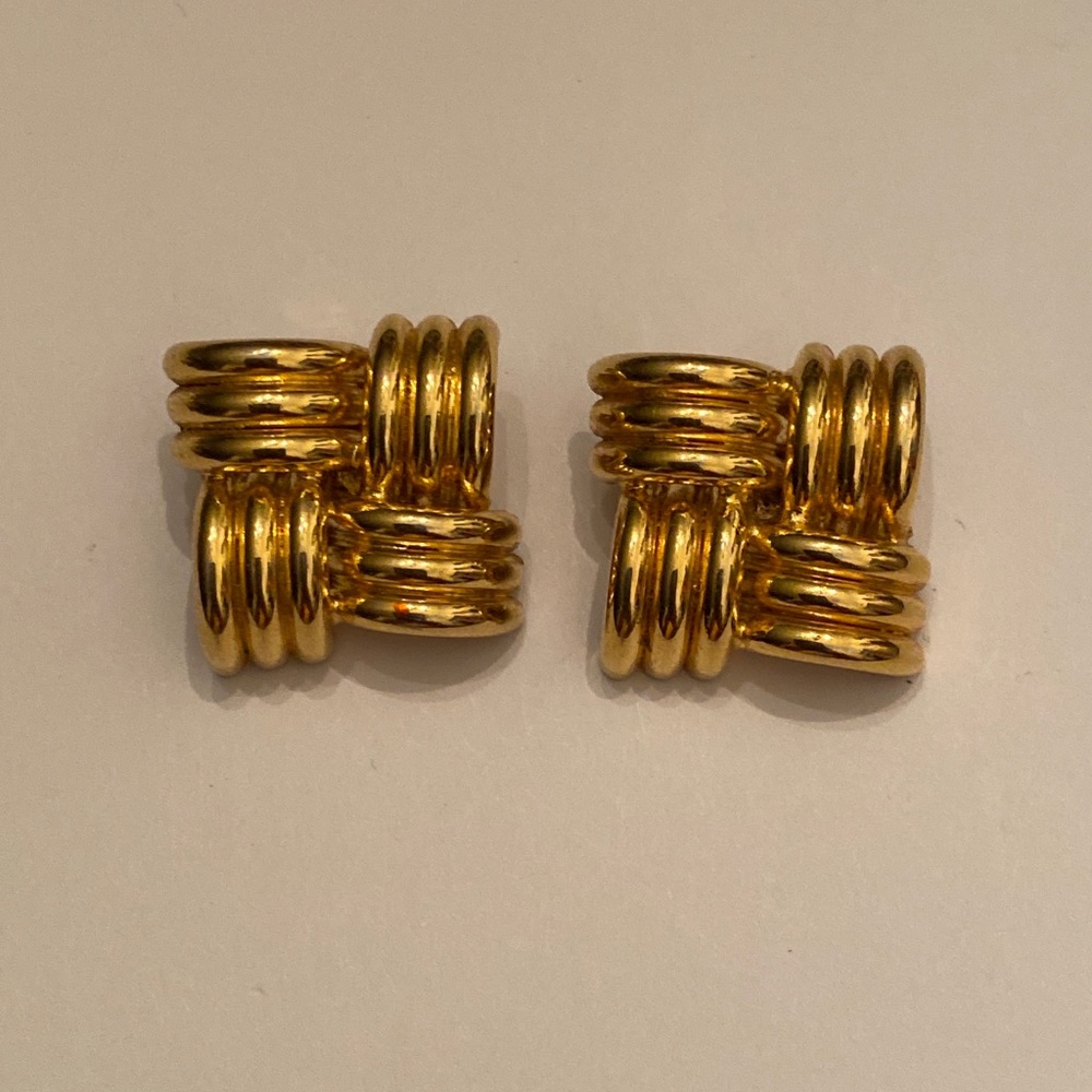 Vintage LCI gold tone clip earrings with checked pattern.